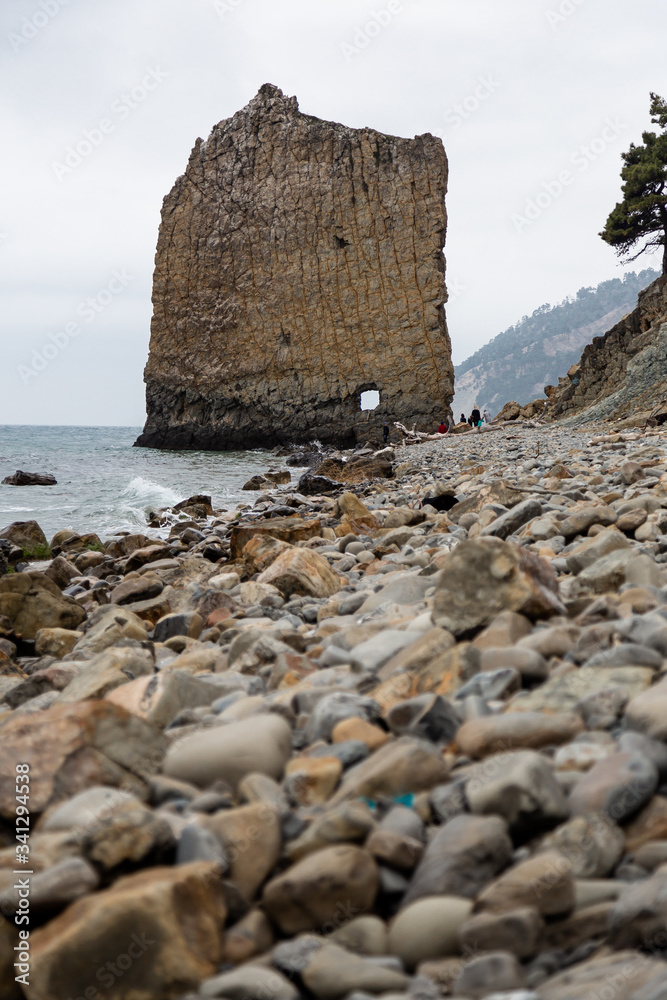 Stones beach at the sea in dark day