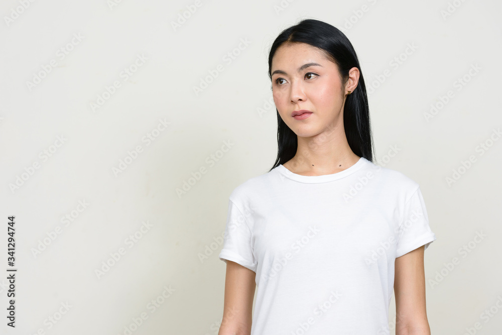 Portrait of young beautiful Asian woman thinking Portrait of young beautiful Asian woman thinking