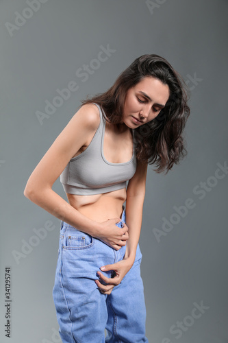 Young woman experiencing ab...