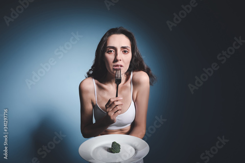 Sick woman with broccoli on...