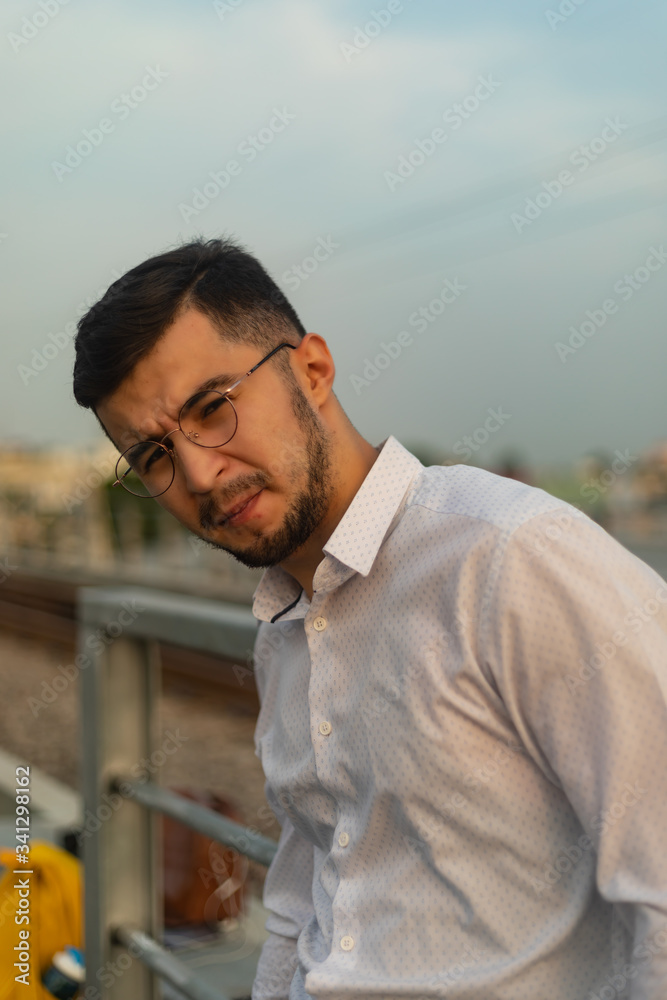Man poses on an old bridge. Man poses on an old bridge.