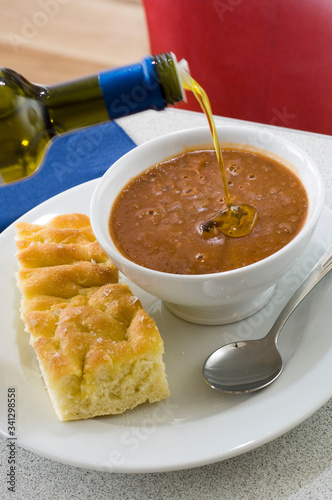 Arabic breakfast with bread, foul modamas with olive oil. close up  photo