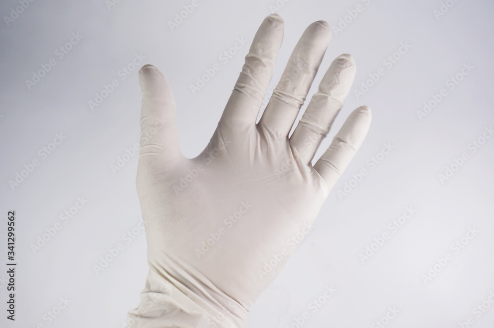 Man hand using medical gloves to prevent infection 2019-nCoV. Protection against contagious disease, coronavirus. Man hand using medical gloves to prevent infection 2019-nCoV. Protection against contagious disease, coronavirus.