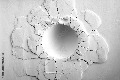 Canvas Print A crater on white powder background. Round crater with cracks.