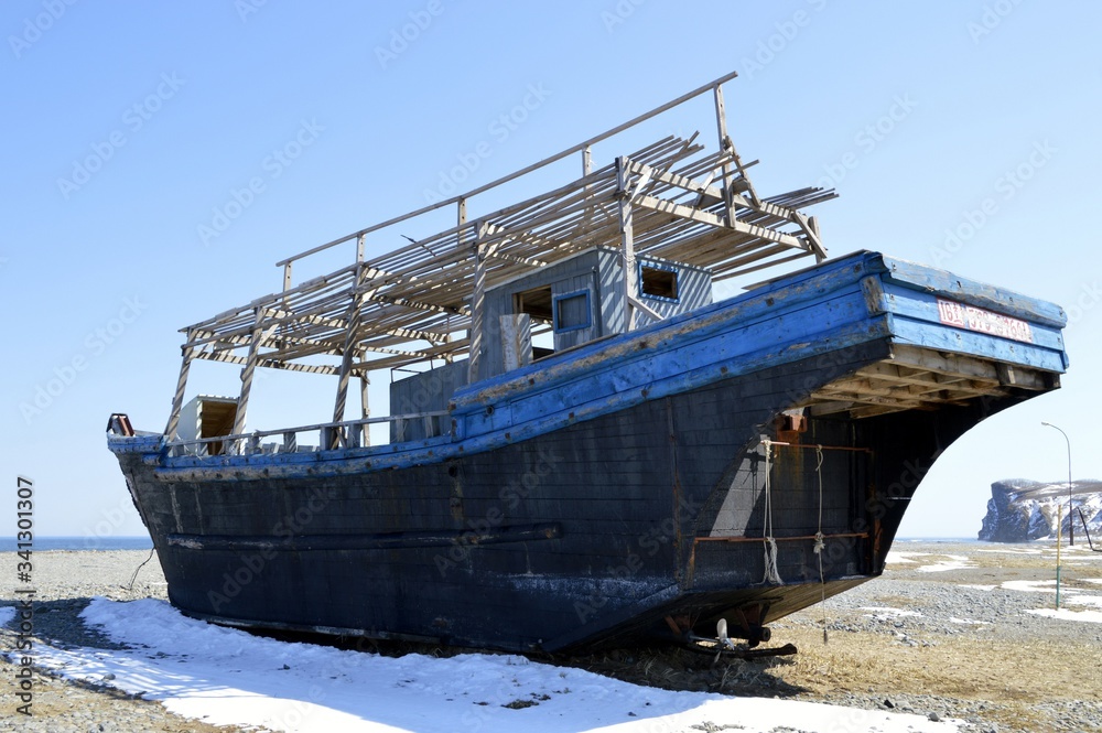Abandoned North Korean fishing schooner on the shore of the Sea of Japan, Primorye, Russia. Abandoned North Korean fishing schooner on the shore of the Sea of Japan, Primorye, Russia.