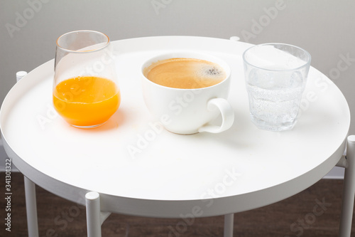 coffee  orange juice and water for breakfast 