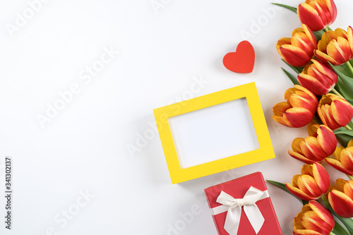Mother's Day Design Concept, Tulip flower bunch - Beautiful Red, yellow bouquet isolated on white background table, top view, flat lay, copy space