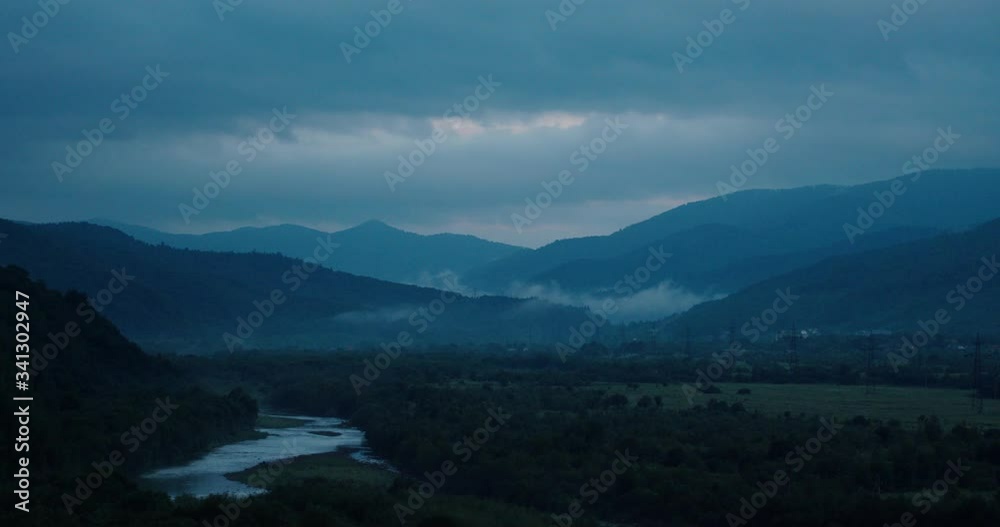 top view. cloudy sky. wide river. green forests. mountains. clouds float over forests and mountains. beautiful nature. top view. cloudy sky. wide river. green forests. mountains. clouds float over forests and mountains. beautiful nature.