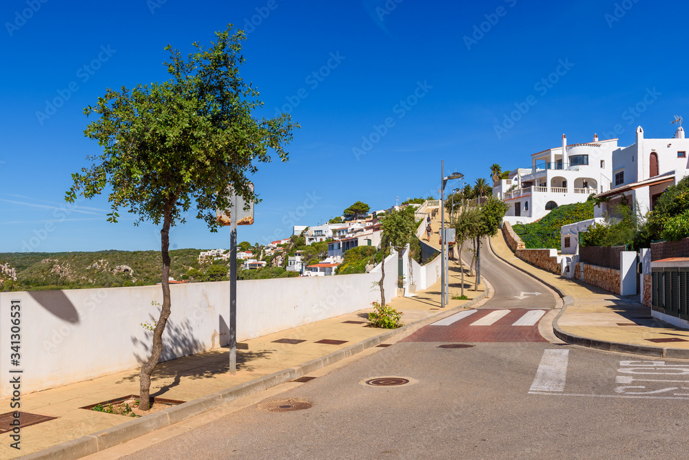 Cala En Porter promenade, one of the best resorts on Menorca, Spain
