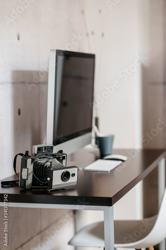 A desk with a computer on a table