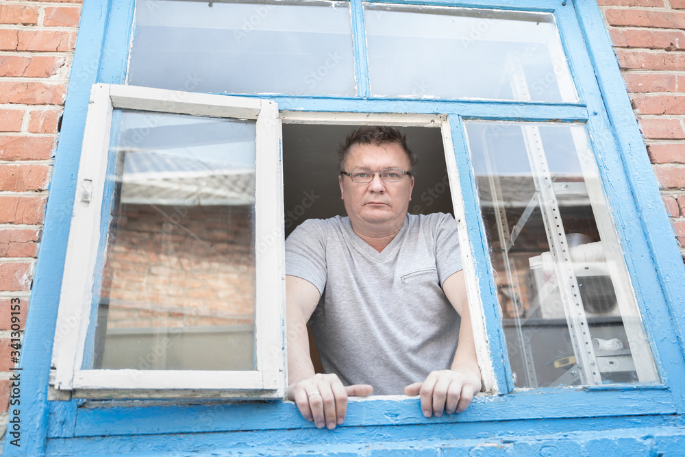 a man looks out the window a man looks out the window