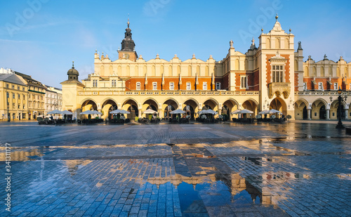 Cloth hall in Krakow reflected in pool of water