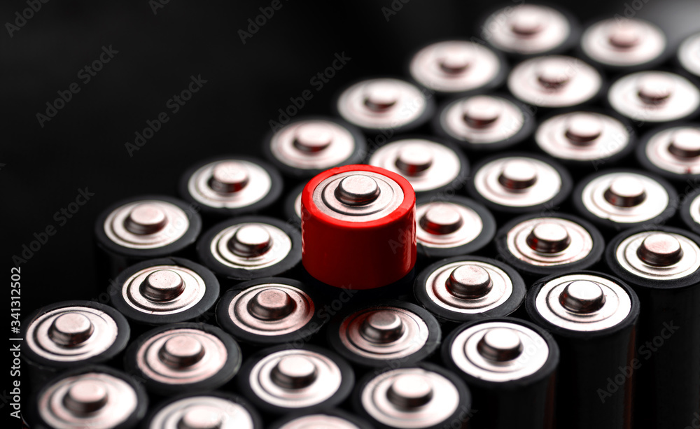A closeup of the positive ends of battery cells. A closeup of the positive ends of battery cells.
