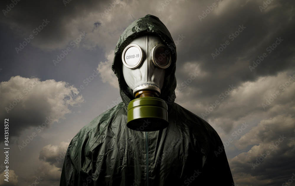 Man wearing a gas mask. COVID-19 crisis and Quarantine concept. Stock Photo  | Adobe Stock