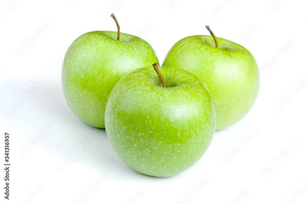Three ripe green apples on a white background. isolated Three ripe green apples on a white background. isolated