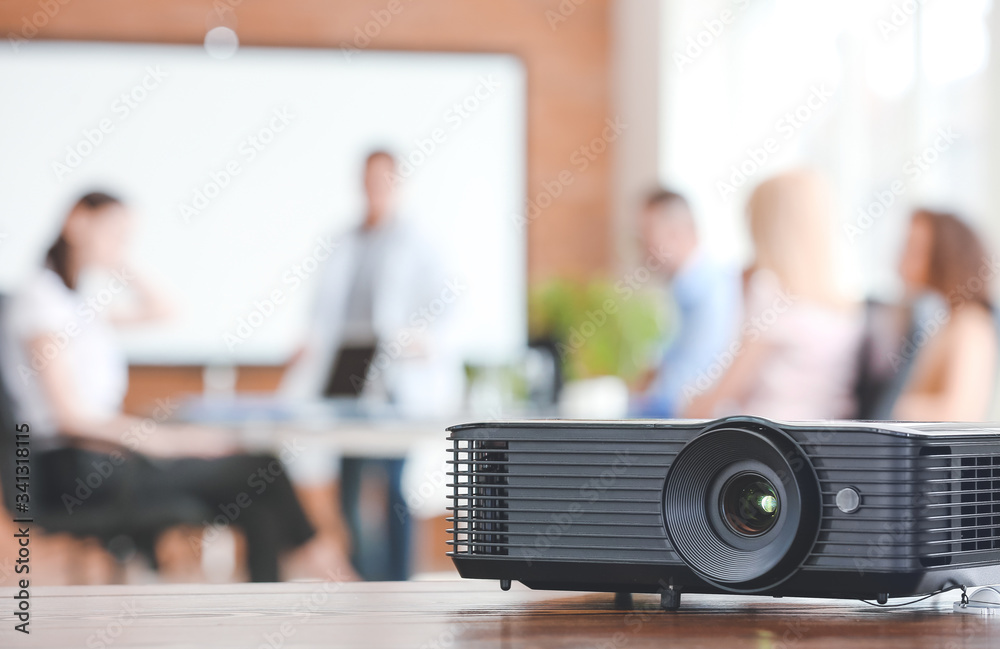 Video projector on table in conference hall foto de Stock | Adobe Stock