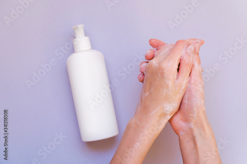 Washing hands using soap foam. Hand hygiene. A woman washes his hands with soap, antibacterial protection
