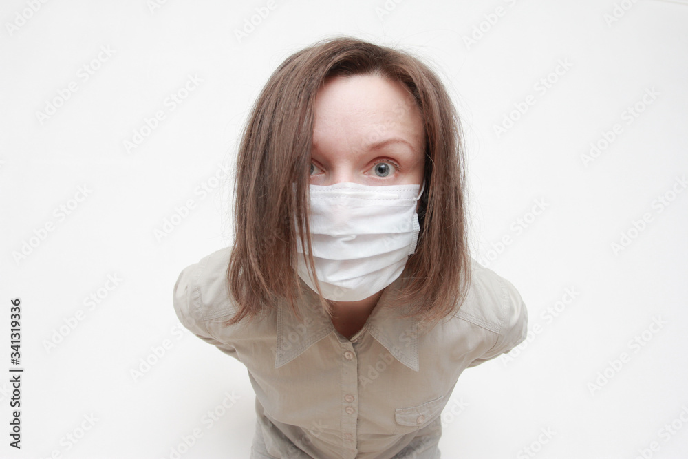 Shocked stressed woman in protective mask staring at camera, standing isolated over white background. Coronavirus, pandemic, outbreak, safety, protection Shocked stressed woman in protective mask staring at camera, standing isolated over white background. Coronavirus, pandemic, outbreak, safety, protection