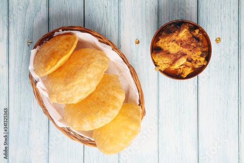 South Indian traditional food Poori or puri with country chicken curry photo