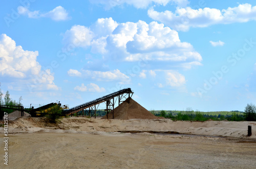 Sand making plant in mining quarry. Crushing factory with production line for crushing, grinding stone, sorting sand and bulk materials. Sand washing for the construction industry