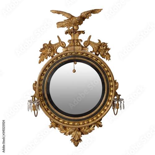 Canvas Print A fine early 19th-century antique giltwood convex mirror with a carved wooden ea