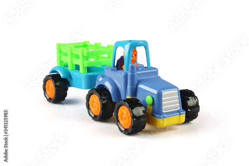 Toy Tractor model with the trailer on a white background