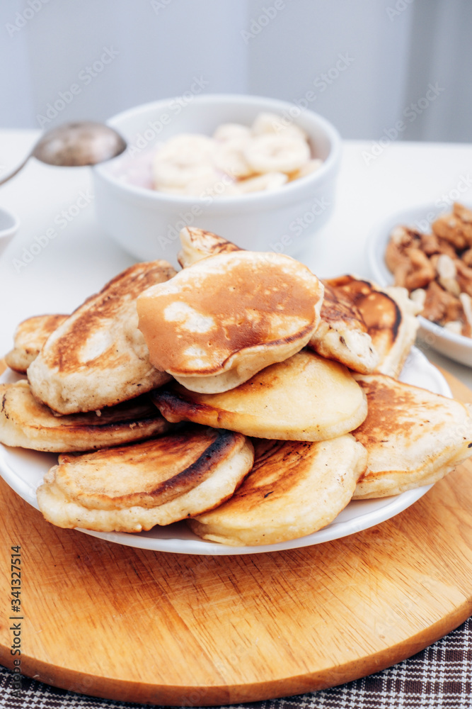Pancakes with banana porridge for breakfast. A stack of pancakes. Milk porridge with banana. Pancakes with banana porridge for breakfast. A stack of pancakes. Milk porridge with banana.