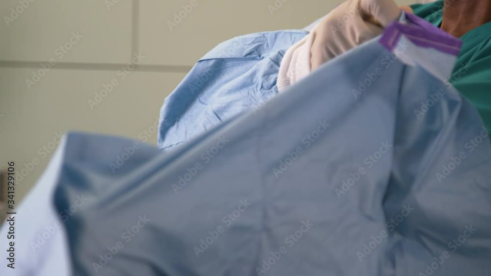CU Surgeon Puts On Surgical Gown CU Surgeon Puts On Surgical Gown