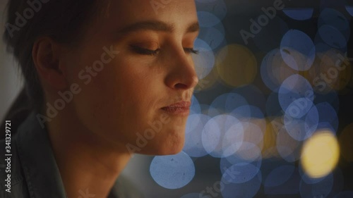 Portrait of a Beautiful Young Woman Eating Delicious Looking Pasta on the Plate. Profesionally Cooked Pasta Dish in the Restaurant or Romantic Dinner Meal at Home. Cozy Candle Light photo