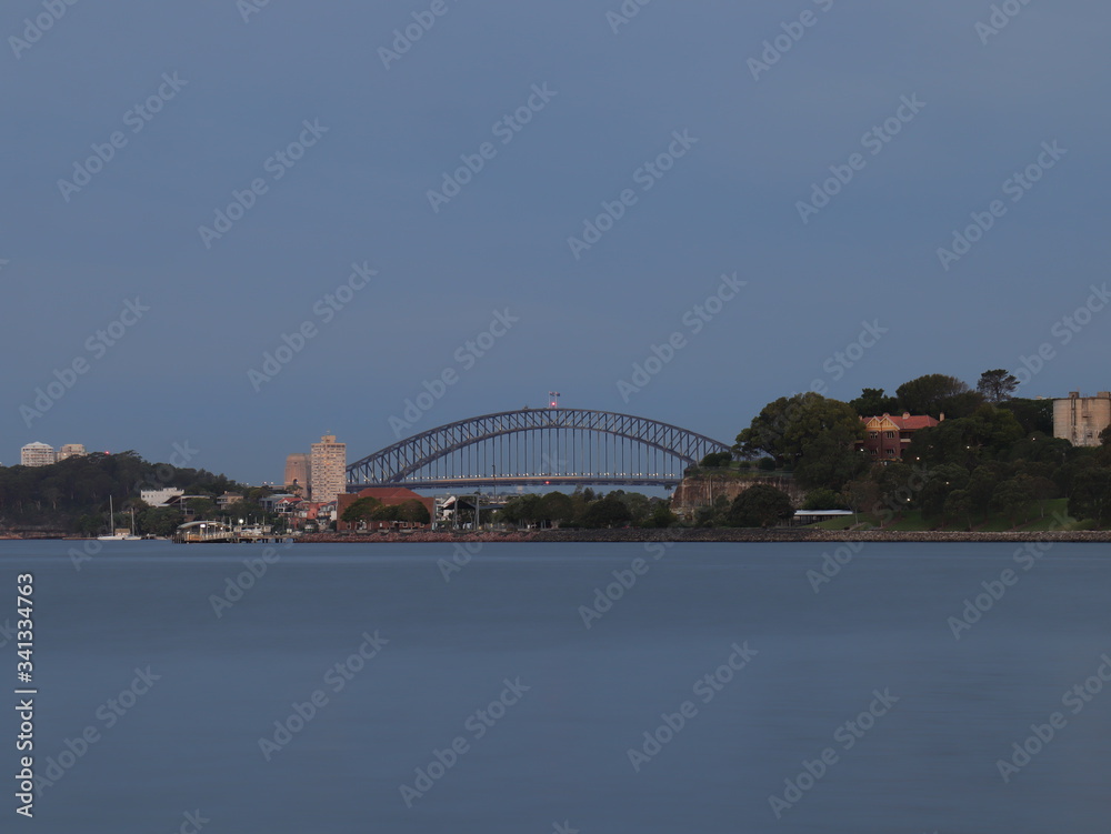 Naklejka premium Drone Panoramic Aerial view of Sydney Harbour and the beautiful vibrant colours of the afternoon showing smooth harbour waters