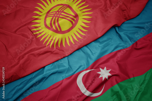 waving colorful flag of azerbaijan and national flag of kyrgyzstan.