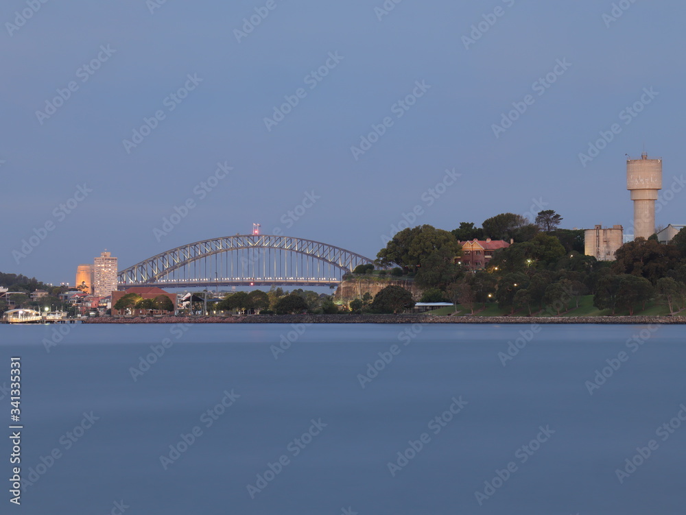 Naklejka premium Drone Panoramic Aerial view of Sydney Harbour and the beautiful vibrant colours of the afternoon showing smooth harbour waters