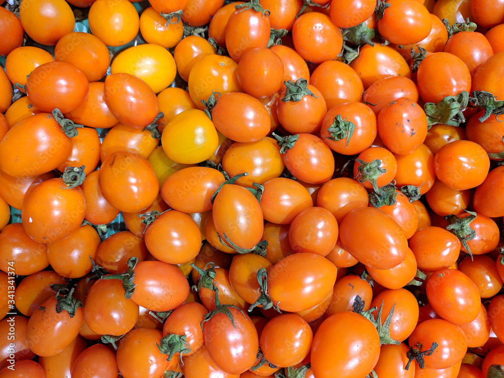 small orange tomatoes in the supermarket small orange tomatoes in the supermarket