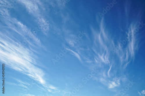 Divorces of clouds on a blue morning sky.