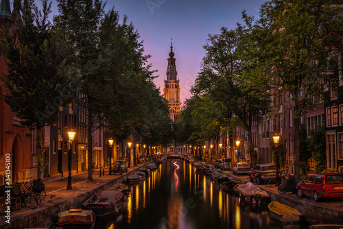 Fototapeta Naklejka Na Ścianę i Meble -  Canals of Amsterdam at night in Netherlands. Amsterdam is the capital and most populous city of the Netherlands.