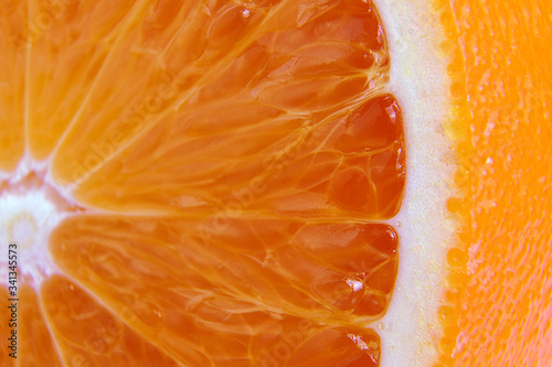 Macro photography of a fresh, ripe, juicy, sweet orange.