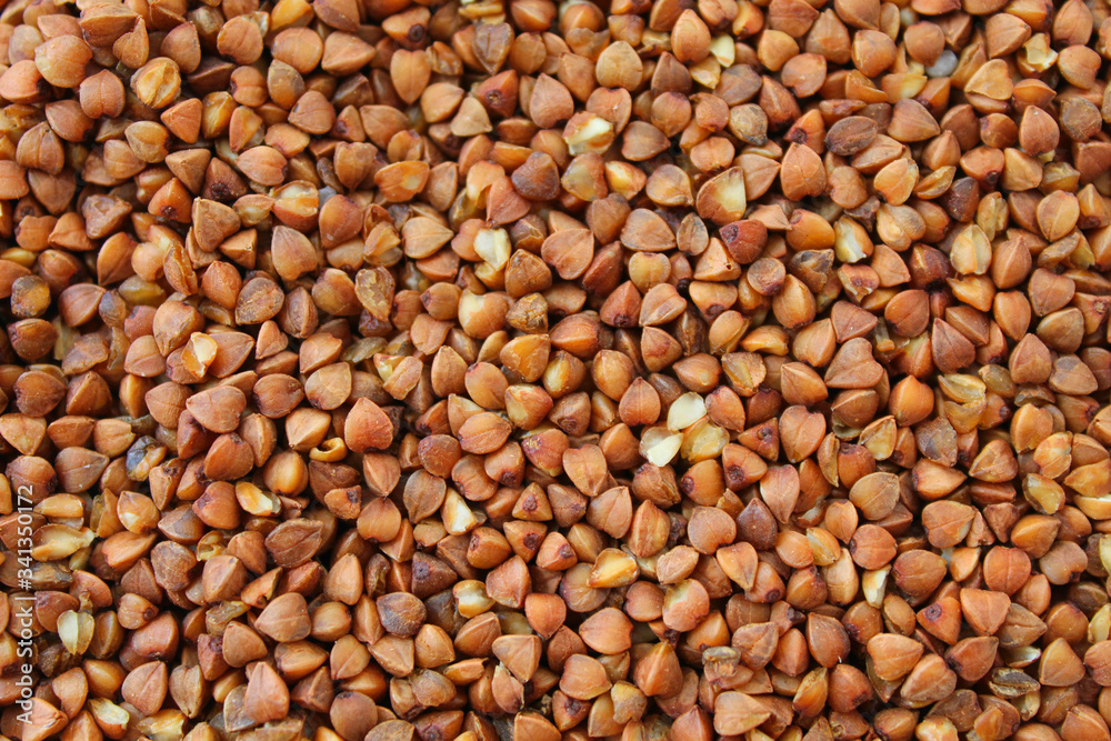 fresh buckwheat. dry buckwheat background, brown grits fresh buckwheat. dry buckwheat background, brown grits