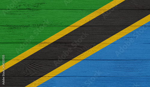 Tanzania flag on a wooden texture. Wood texture, planks Wooden texture background flag. Flag painted with paints on wood 