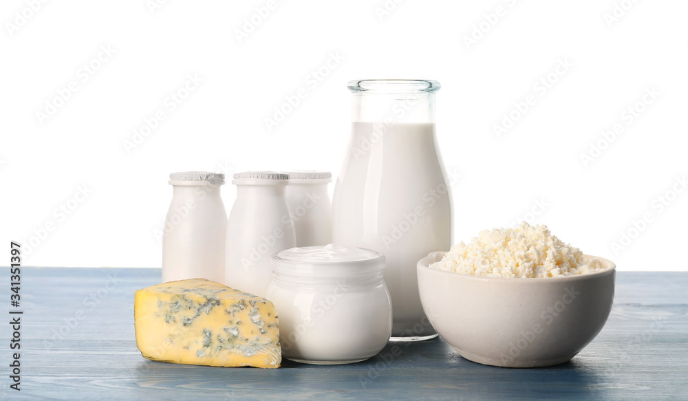 Different dairy products on table against white background Different dairy products on table against white background