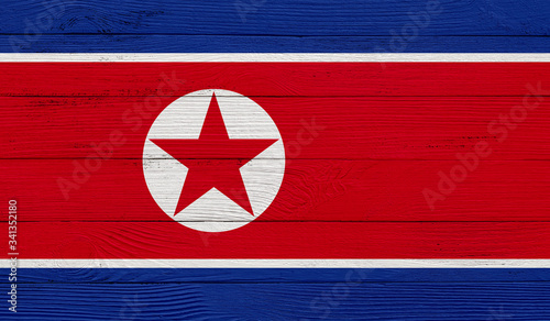 North Korea flag on a wooden texture. Wood texture, planks Wooden texture background flag. Flag painted with paints on wood