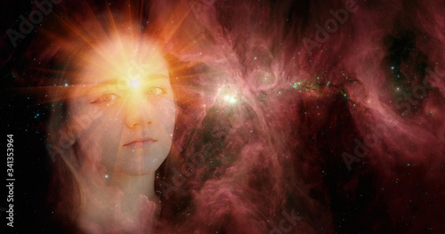 Billede på lærred The face of a young clairvoyant girl against the background of galaxies with a shining star in her forehead
