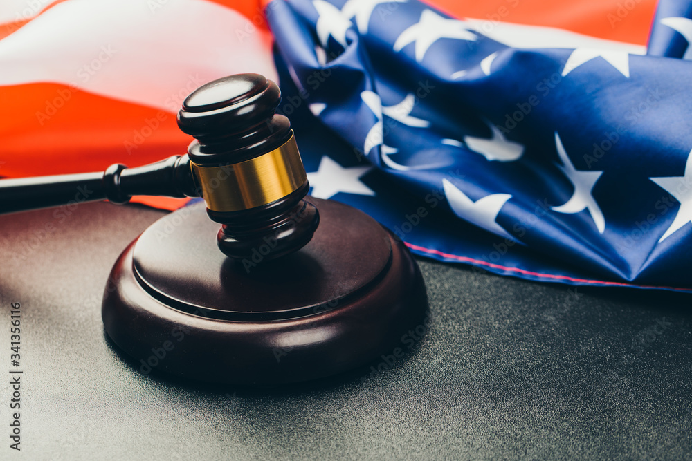law gavel and USA america flag - American crime concept law gavel and USA america flag - American crime concept