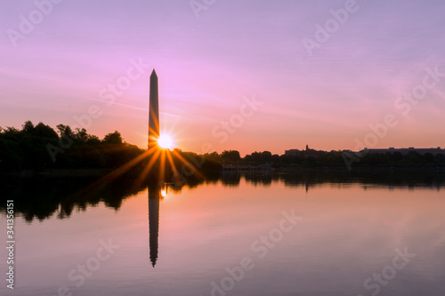 Washington DC panorama at Tidal Basin during sunrise. US capitol landscape of National Mall with distinctive obelisk of Washington Monument at sunrise. © othman