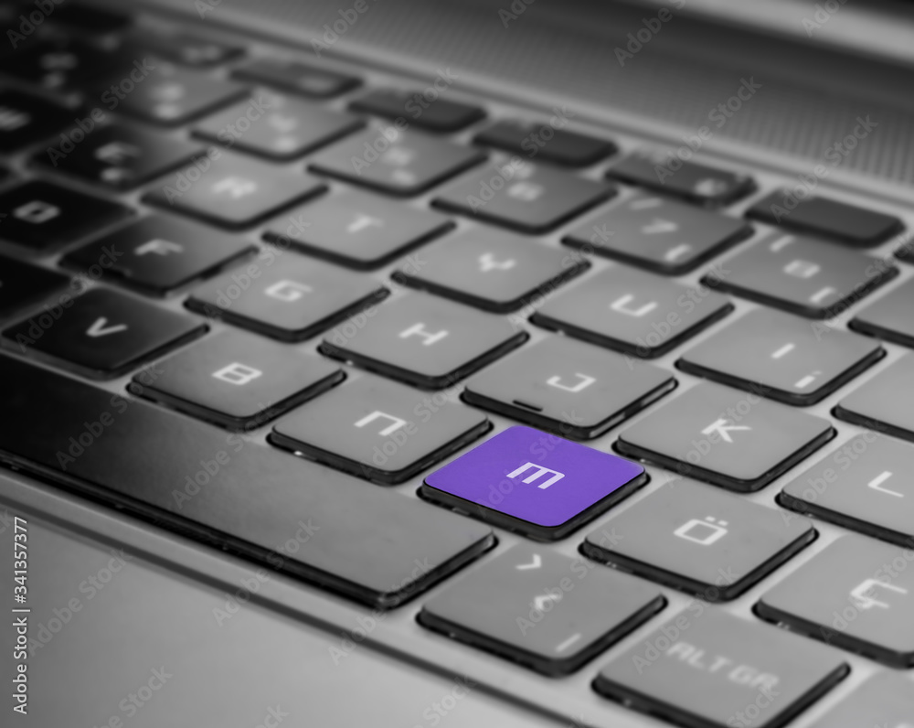 purple m letter on keyboard, notebook keyboard front view