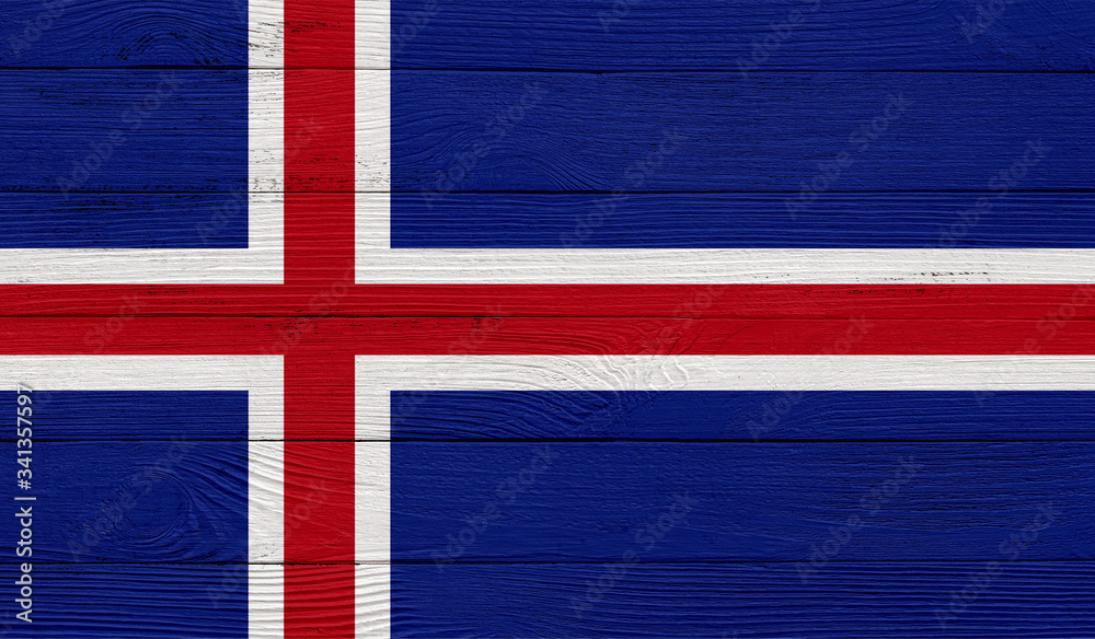 Fototapeta premium Iceland flag on a wooden texture. Wood texture, planks Wooden texture background flag. Flag painted with paints on wood