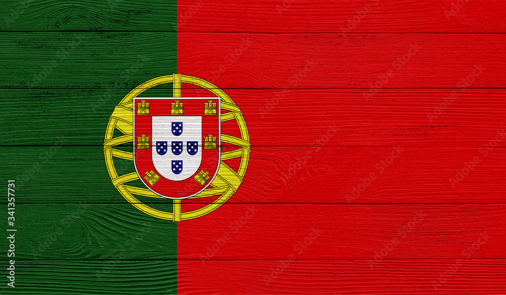 Fototapeta premium Portugal flag on a wooden texture. Wood texture, planks Wooden texture background flag. Flag painted with paints on wood
