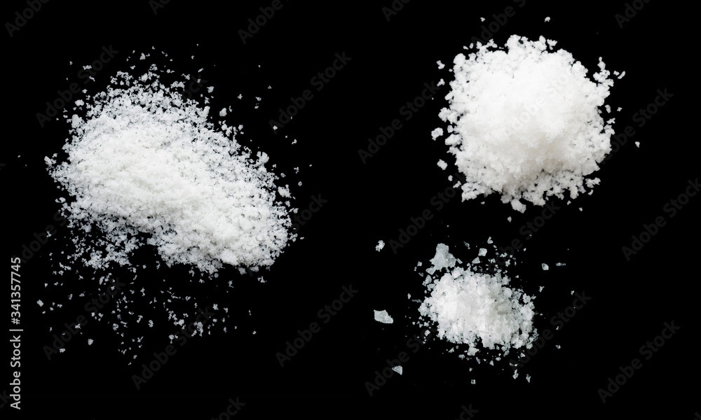  salt on a black background,salt on wooden spoon isolated on white background,A pile of coarse salt on a black background