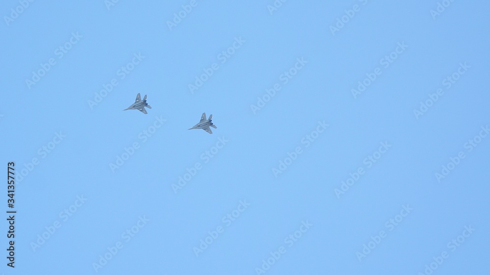 Two fighter jets flying at high altitude