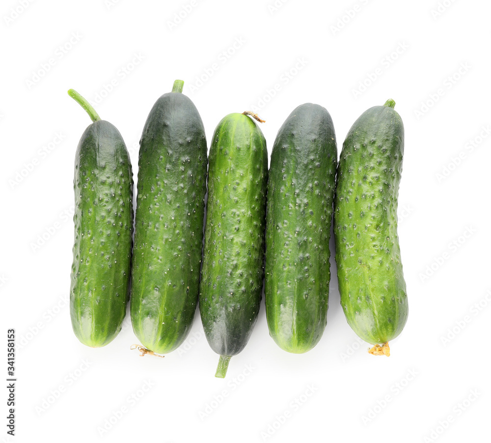 Green cucumbers on white background Green cucumbers on white background