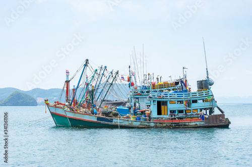 Large fishing boats moored in the sea.